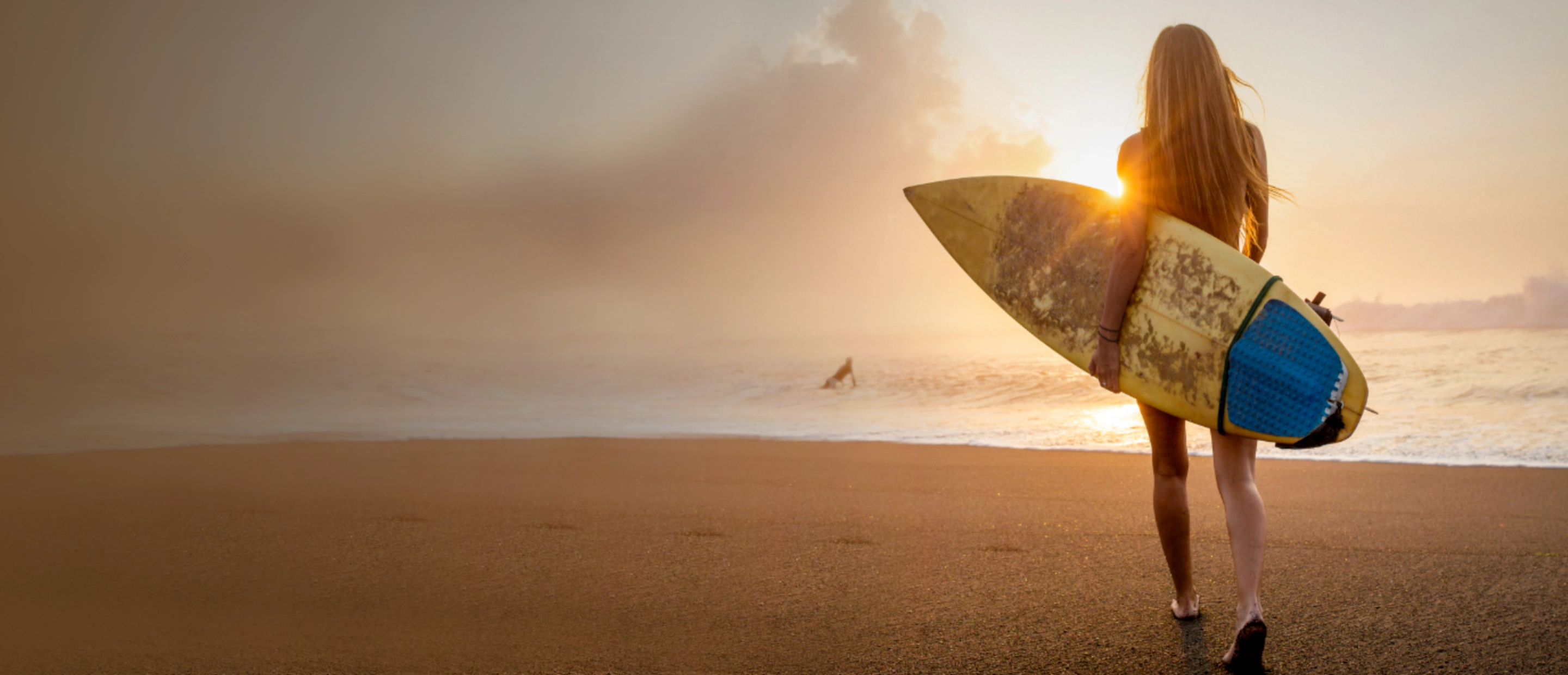 Woman with surfboard